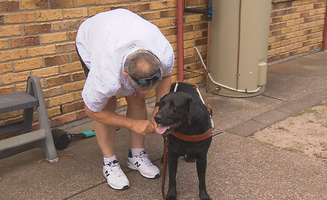 Vision-impaired man’s guide dog funding restored